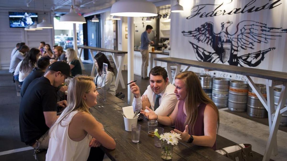 Erin Chavanne, Charles Watson and Rachael Mack dine at the Federalist Public House on June 3, 2015, in Sacramento, Calif. The establishment is expanding its hours beginning July 1, 2017.