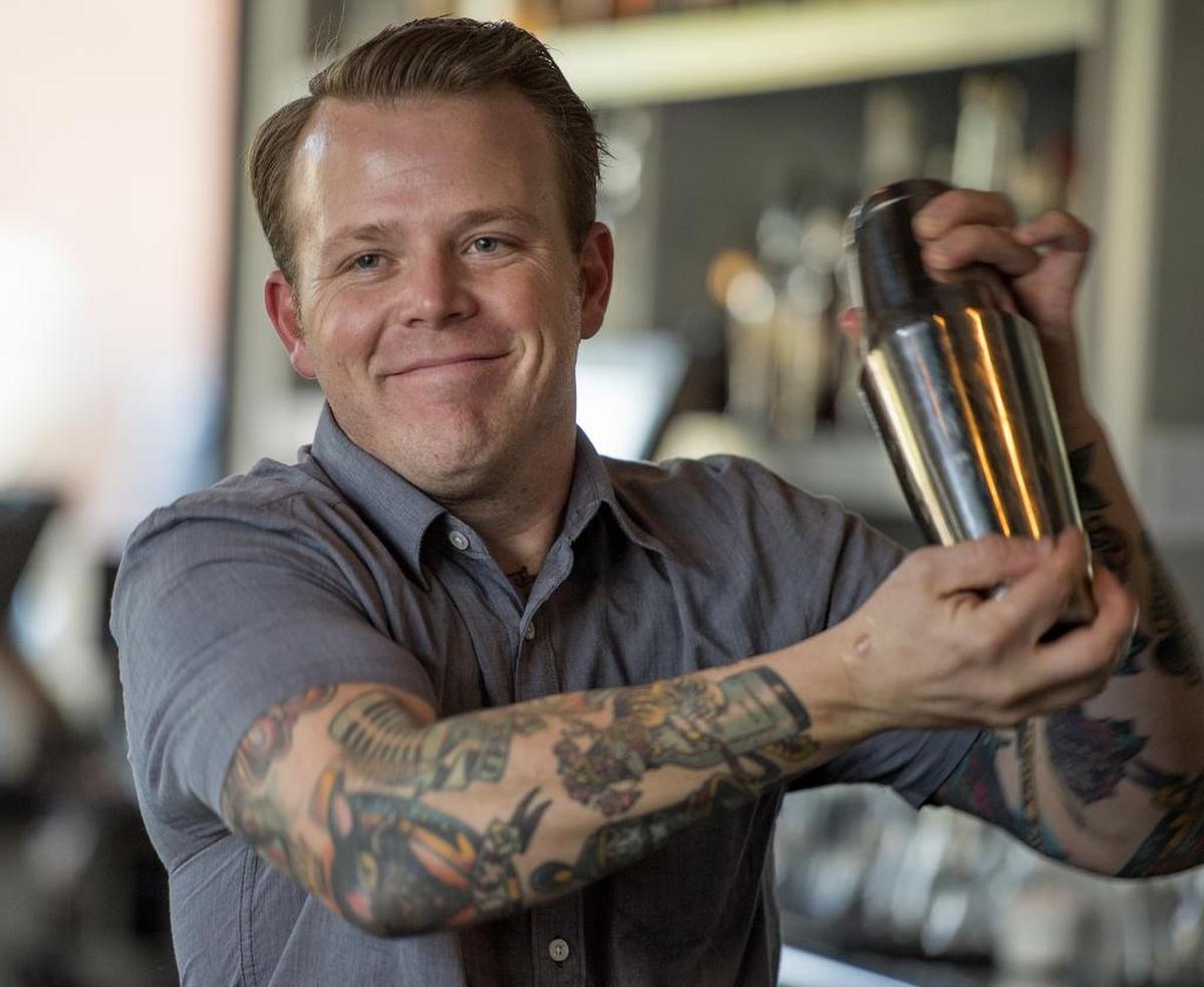Jayson Wilde tends bar at Bottle & Barlow on R Street.