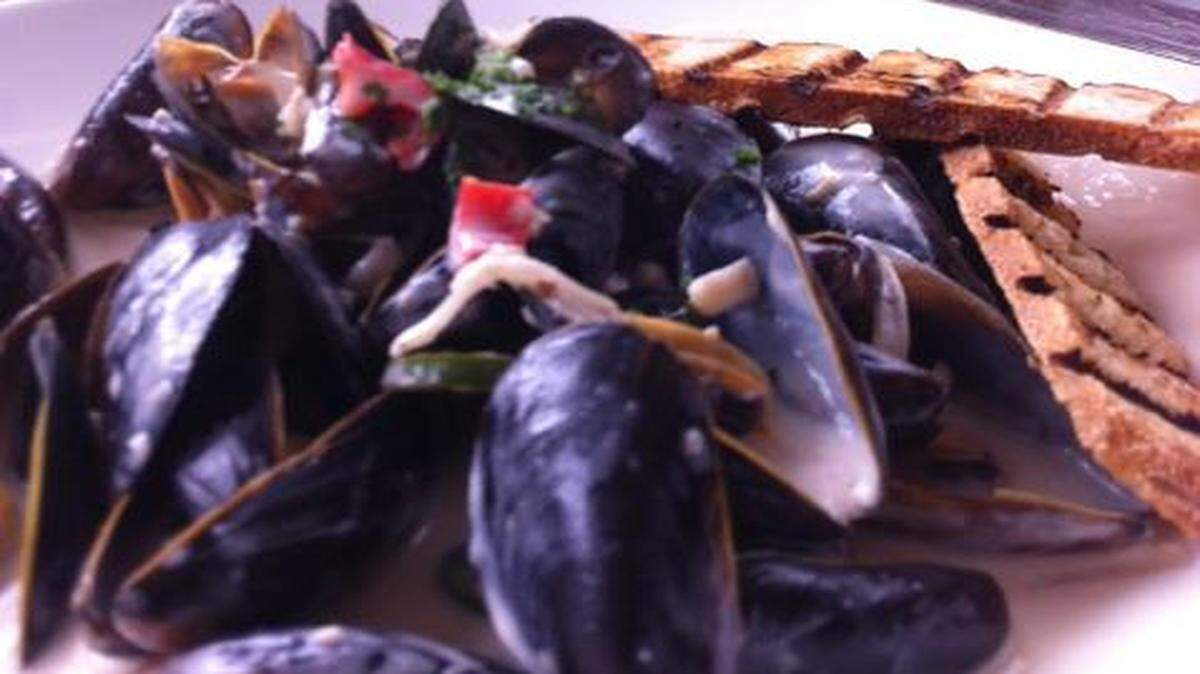 
Plan B Cafe: Mussels in coconut milk-based broth, with a cone of french fries. 
