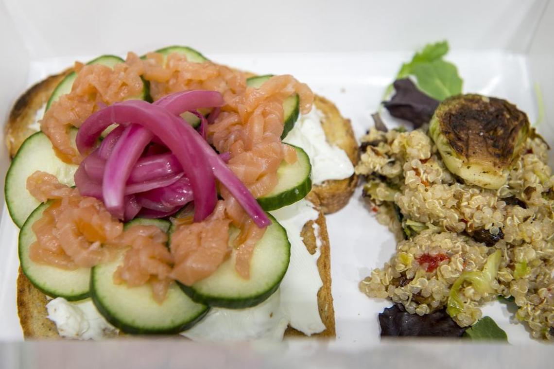 The School House Special is smoked salmon over cream cheese with cucumber and pickled onion served open face over toast at Recess Cafe on Tuesday July 3, 2018 in Sacramento. On the side is Quinoa & Brussels Sprouts Salad that includes quinoa, charred brussels sprouts, roasted red bell peppers with Dijon vinaigrette. 