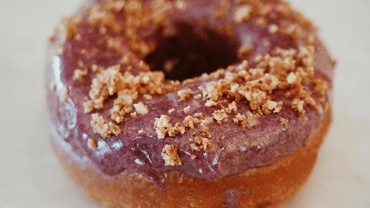 Shown is a blueberry Piebrioche doughnut, featuring a blueberry glaze. The plan is for Milk Money to offer several flavors of ice cream and a different type of doughnut each day, which will be available from opening at 8 a.m. until it sells out.