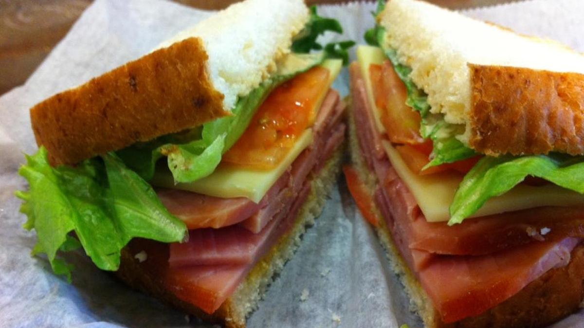 A classic ham sandwich featuring applewood-smoked ham at HoneyBaked Cafe