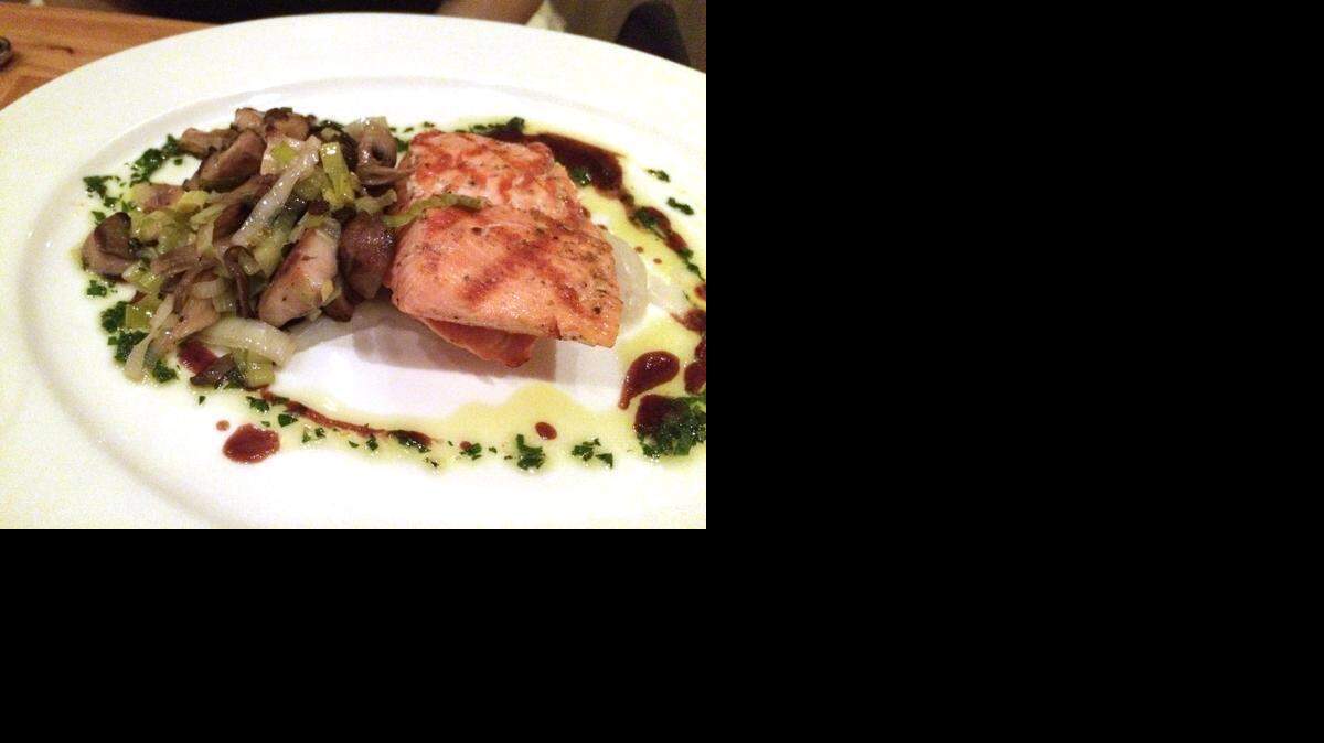 
King salmon is on the menu at The Press. Other entrees include a Bolognese lasagna, swordfish, and pork chop with collard greens. Among the desserts: chocolate lava cake. 
