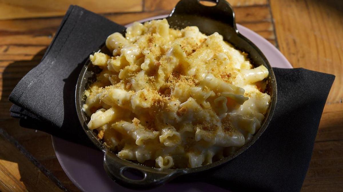 The Rind’s Not Your Mom’s Mac includes Black Dia mond cheddar, Gruyère and aged Parmigiano-Reggiano.