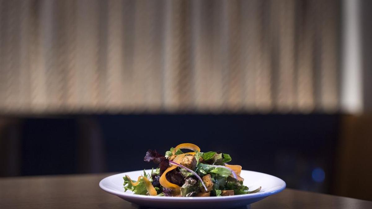 Wildwood Kitchen & Bar's field greens salad embodies a zippy lightness with its red onion slivers, carrot shavings and an assertive grain-mustard vinaigrette. It goes for $5.95.