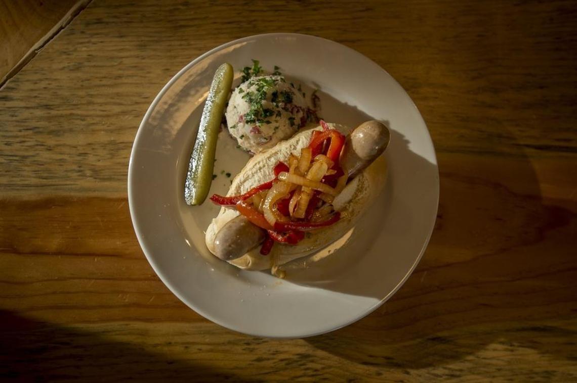 Sausage sandwich with onions and peppers at Oakhaus.