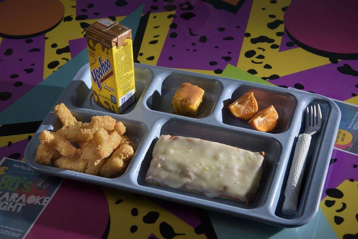 The cheese pizza kid's meal served on a cafeteria tray at the Back to the 80s Cafe & More in Rancho Cordova on Tuesday, March 6, 2018.