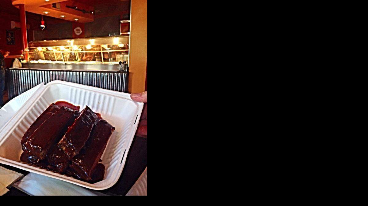 
Sauce-covered St. Louis-style spareribs join the barbecue lineup at Sticky Gator. 
