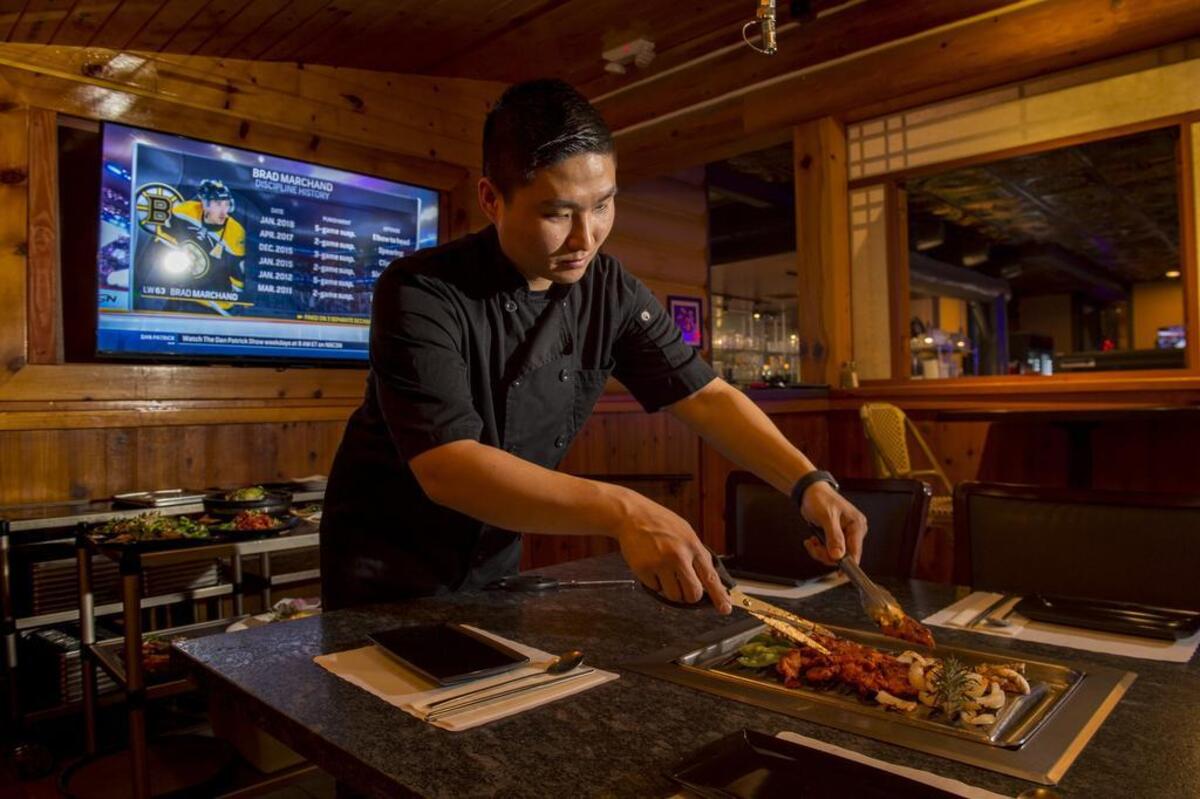 Chef Alexander Park cooks spicy pepper paste chicken at Blue House.