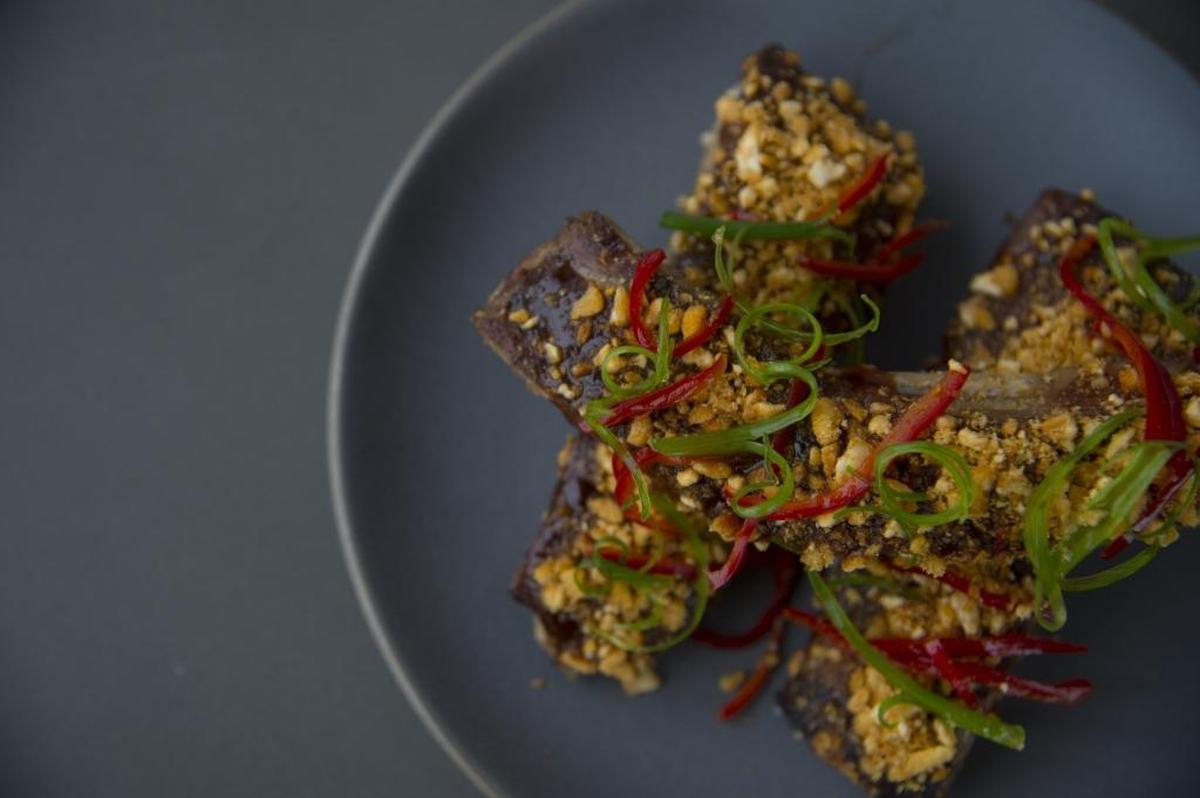 St. Louis ribs include espresso tamarind sauce, corn nuts, scallions and pickled chilies.