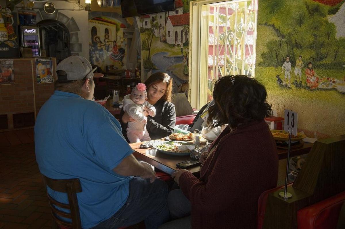 From left, Frank Reynosa, Eliana Reynosa (age 1), Berenice Munoz and Yancy Reynosa have lunch Tuesday at Taqueria Maya on Broadway in Sacramento.