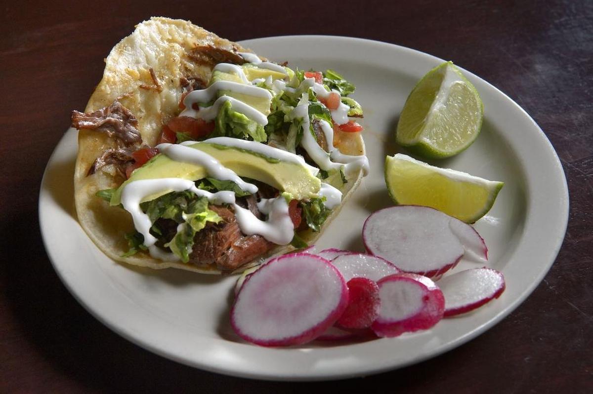 Crispy taco con biria at Taqueria Maya. The owners are planning another restaurant.