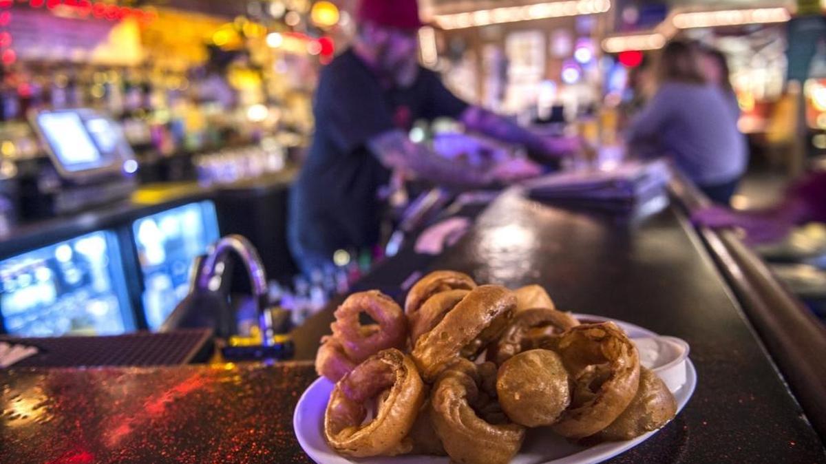 Olympia beer-battered onion rings ($5) are served with homemade ranch and ketchup at The Hideaway on Franklin Boulevard.