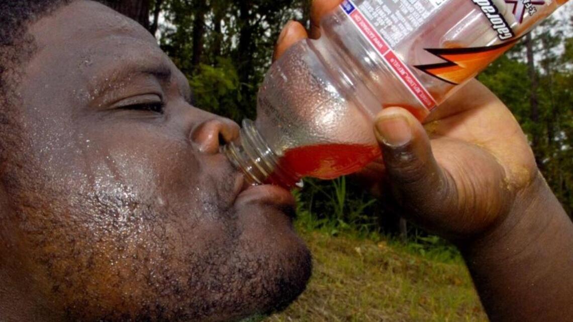 In summer heat, stay hydrated with water or sports drinks