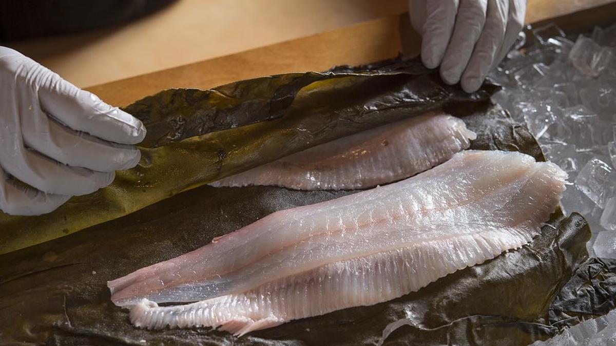 Hirame (flounder) is wrapped in kombu, a seaweed from Japan, and cured for an hour to 90 minutes at Kru, a popular J Street restaurant in Sacramento.