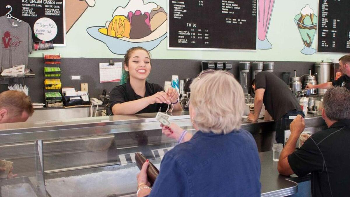 A customer treats herself to Vic’s Ice Cream on Riverside Boulevard. Burglars broke into the cafe early Wednesday morning.