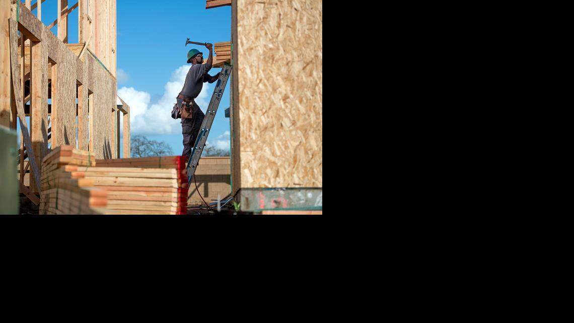 
Luis Armando Garcia of Sacramento works at a construction site in Elk Grove in February. Garcia said construction work has been keeping him busier this year.

