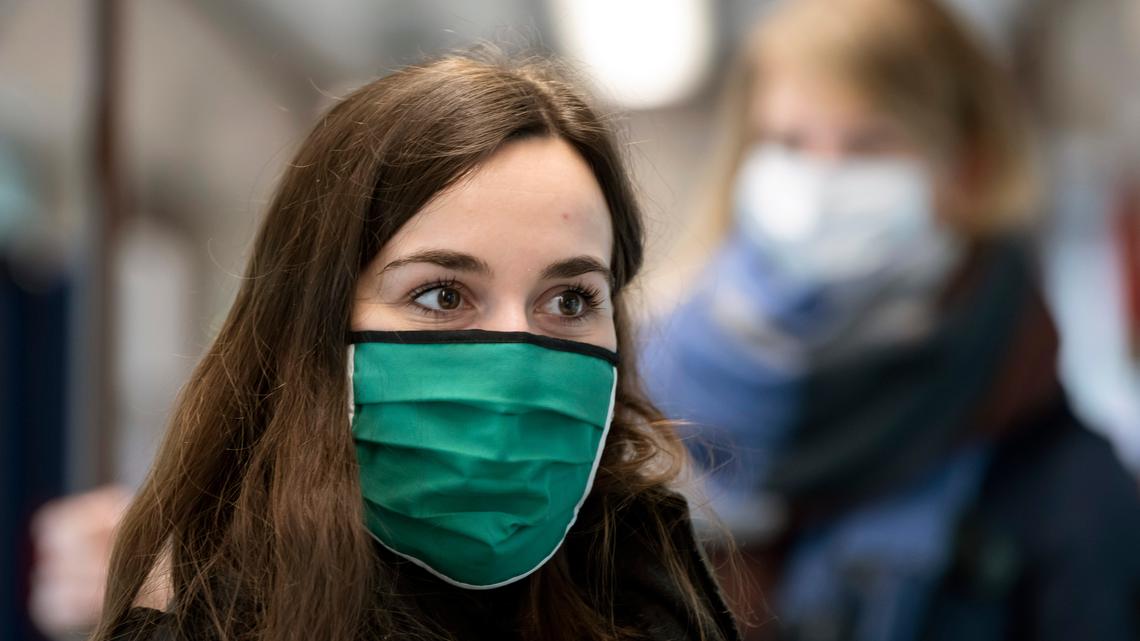 Women wearing face masks in a tramway during a media presentation in Jena, Germany, Friday, April 3. Jena became first German city to make wearing a face mask mandatory.