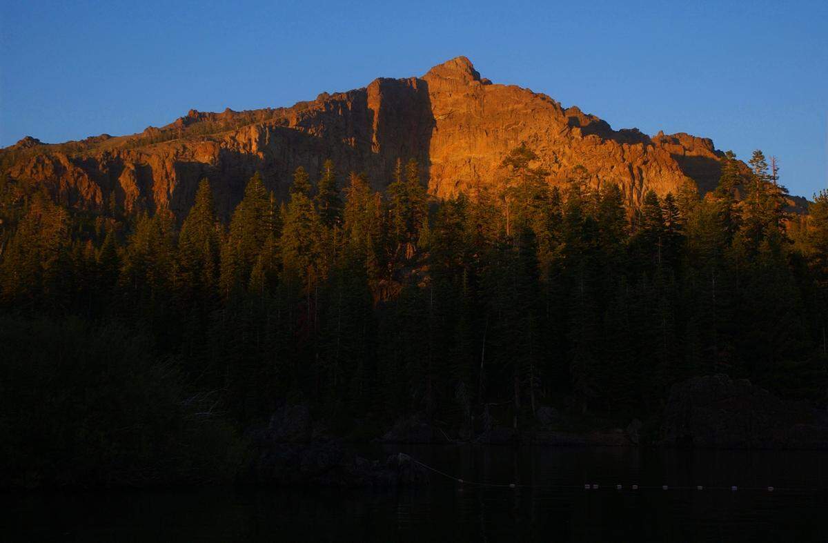 Evening light illuminates the summit of Thunder Mountain in 2004 above Eldorado National Forest’s Silver Lake.
