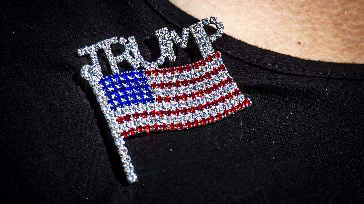 Trump supporter Linda Martinez-Hanna wears a jeweled pin declaring her support for President Donald Trump at her home on Monday, Oct. 19, 2020. The El Dorado Hills resident joined Latinos for Trump in 2018. A new poll from the Public Policy Institute of California finds 33% of Latinos in California plan to vote for Trump. 