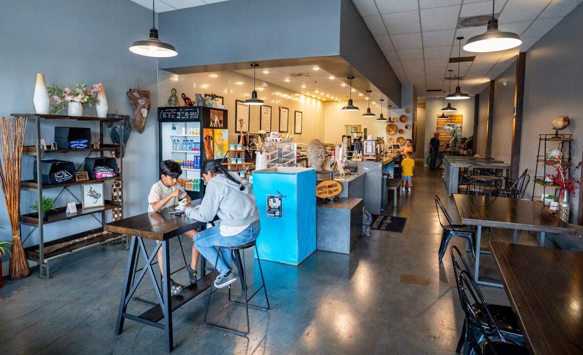 Customers eat and drink at Savvy House Coffee Bar in Elk Grove on Aug. 17, 2022.
