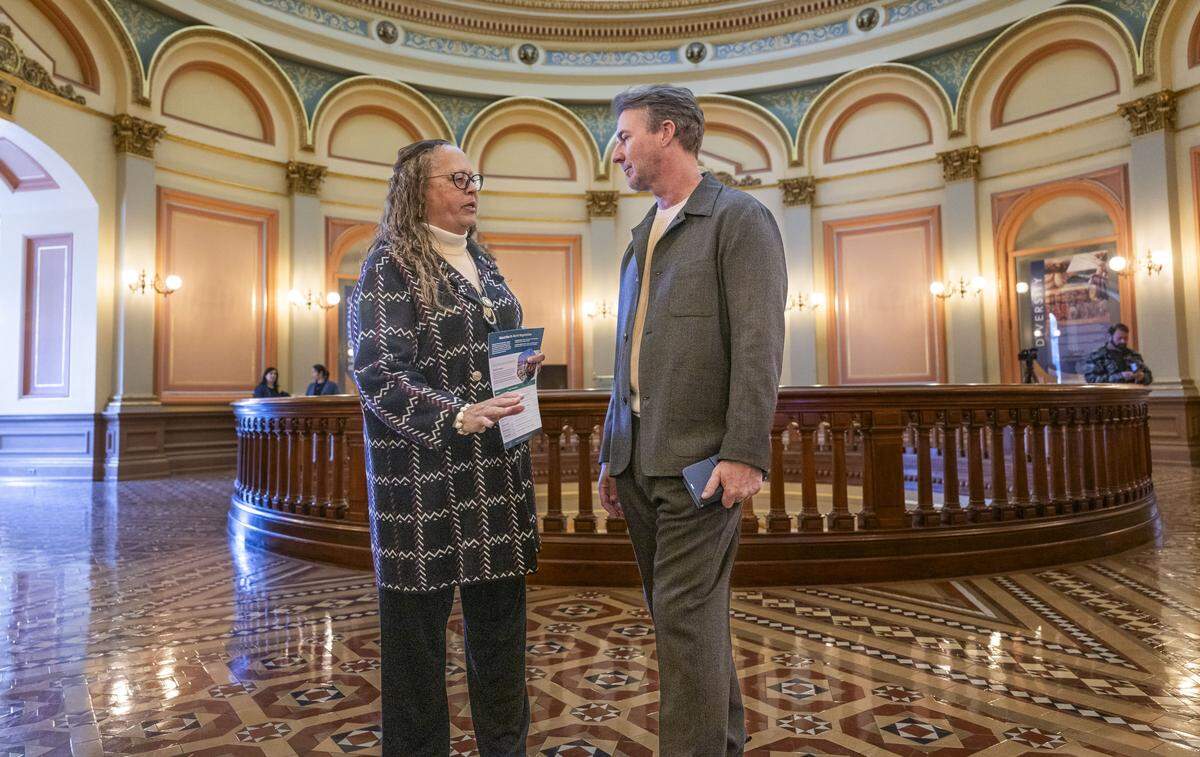 Actor and entrepreneur Edward Norton talks with state Sen. Laura Richardson, D-San Pedro, as he visits the state Capitol on Tuesday to promote Stax Engineering. Norton is co-founder and investor of the company, which is developing emission capture systems for seaports.  