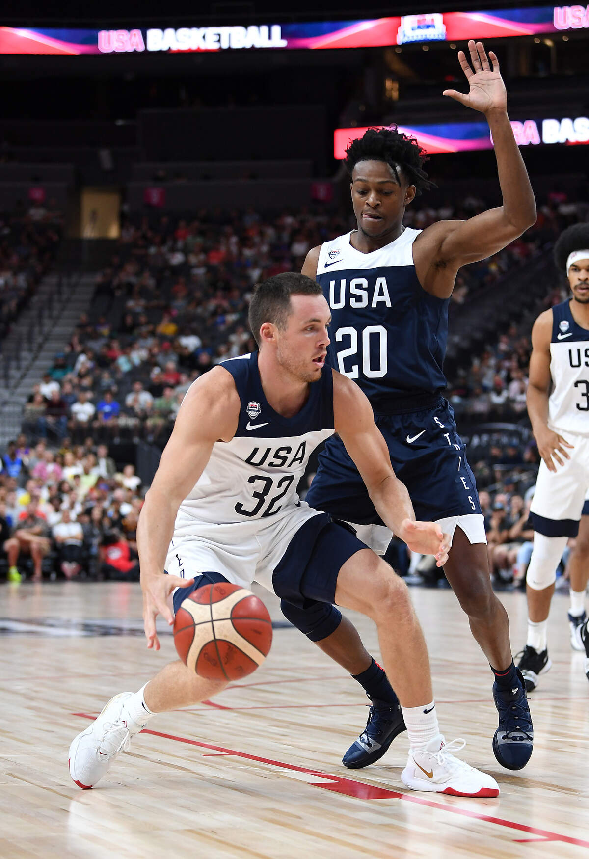 USA Men’s National White Team guard Pat Connaughton (32) dribbles against USA Men’s National Blue Team guard De’Aaron Fox (20) during the first half of the USA Basketball Men’s National Team intrasquad game on Aug. 9, 2019, at T-Mobile Arena in Las Vegas, Nevada.