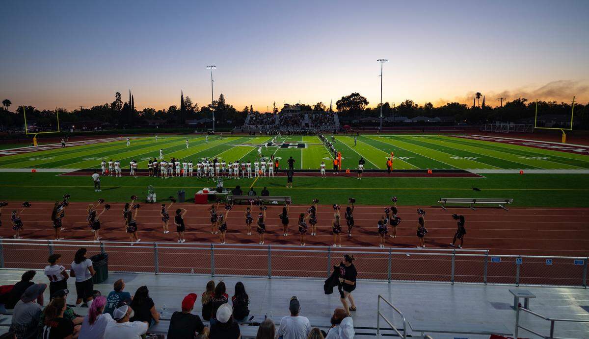 The Hiram Johnson Warriors prepare to kick off against the Bella Vista Broncos in their season opener on Friday. It was the Warriors’ first game in the Sacramento high school’s newly renovated football stadium, where games can now be played under lights at night. Home and away bleachers with almost 1,700 seats, an overhead entrance sign and home and visitor concession and restroom buildings have also been added.