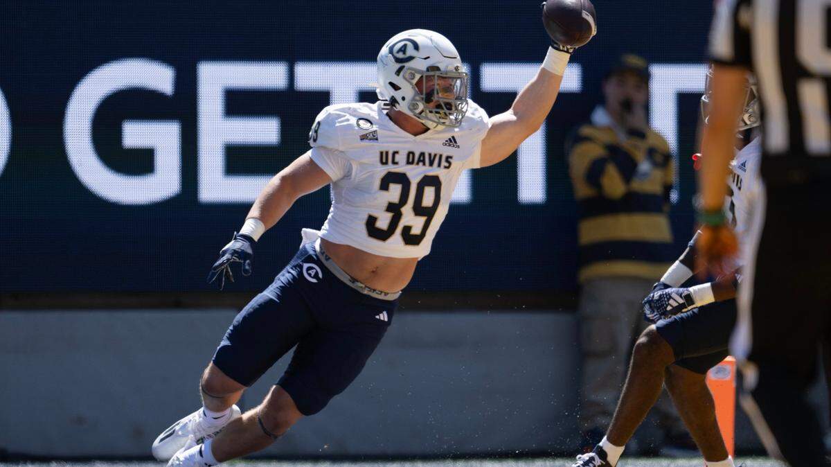 UC Davis Aggies linebacker Porter Connors (39) celebrates after picking up a fumble and returning it for a touchdown in the second quarter against the California Golden Bears on Saturday at Memorial Stadium in Berkeley. The Aggies lost to Cal, 31-13, and hope to bounce back in their home opener this Saturday.