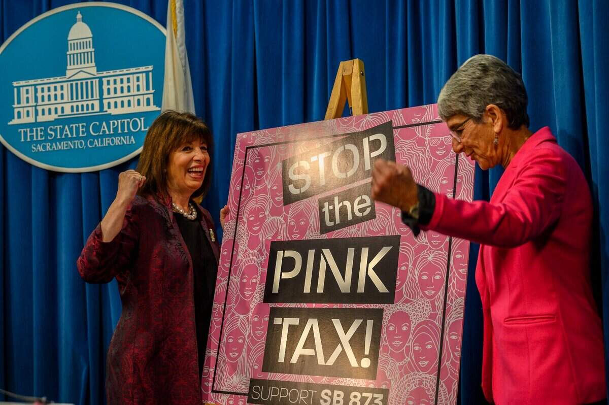 Congresswoman Jackie Speier, D-Hillsborough, left, and state Senator Hannah-Beth Jackson, D-Santa Barbara, right, hold up fists after a press conference advocating the end to the so-called “pink tax,” where womens products are priced higher than the same products marketed to men, at the California State Capitol in Sacramento on Tuesday, Feb. 18, 2020. Senate Bill 873 would make it illegal to charge customers different prices on the basis of gender for substantially similar goods.