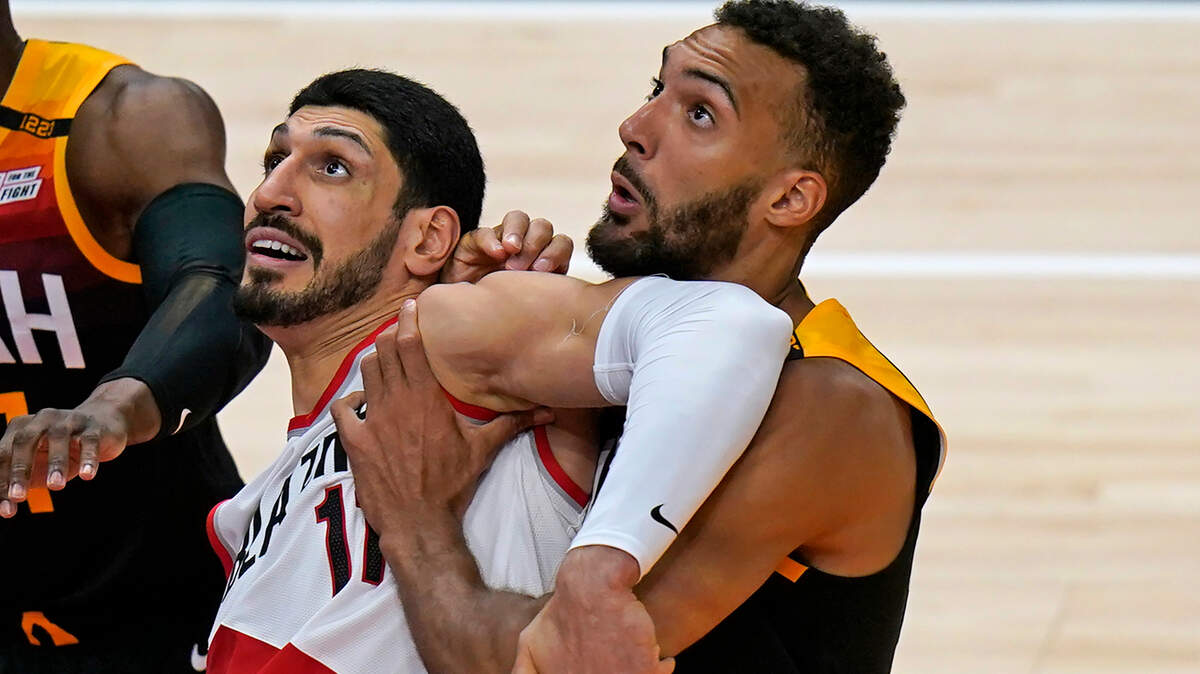 Portland Trail Blazers center Enes Kanter (11) and Utah Jazz center Rudy Gobert, right, work for position under the boards during the second half of an NBA basketball game Wednesday, May 12, 2021, in Salt Lake City. (AP Photo/Rick Bowmer)