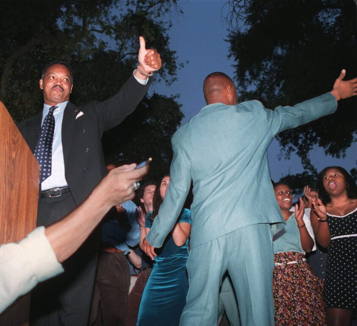 The Rev. Jesse Jackson gives a thumbs up to the 300 plus crowd gathering in the quad at UC Davis on Oct, 26, 1997, the second day of his Save the Dream march, which would finish at the state Capitol the following day.
