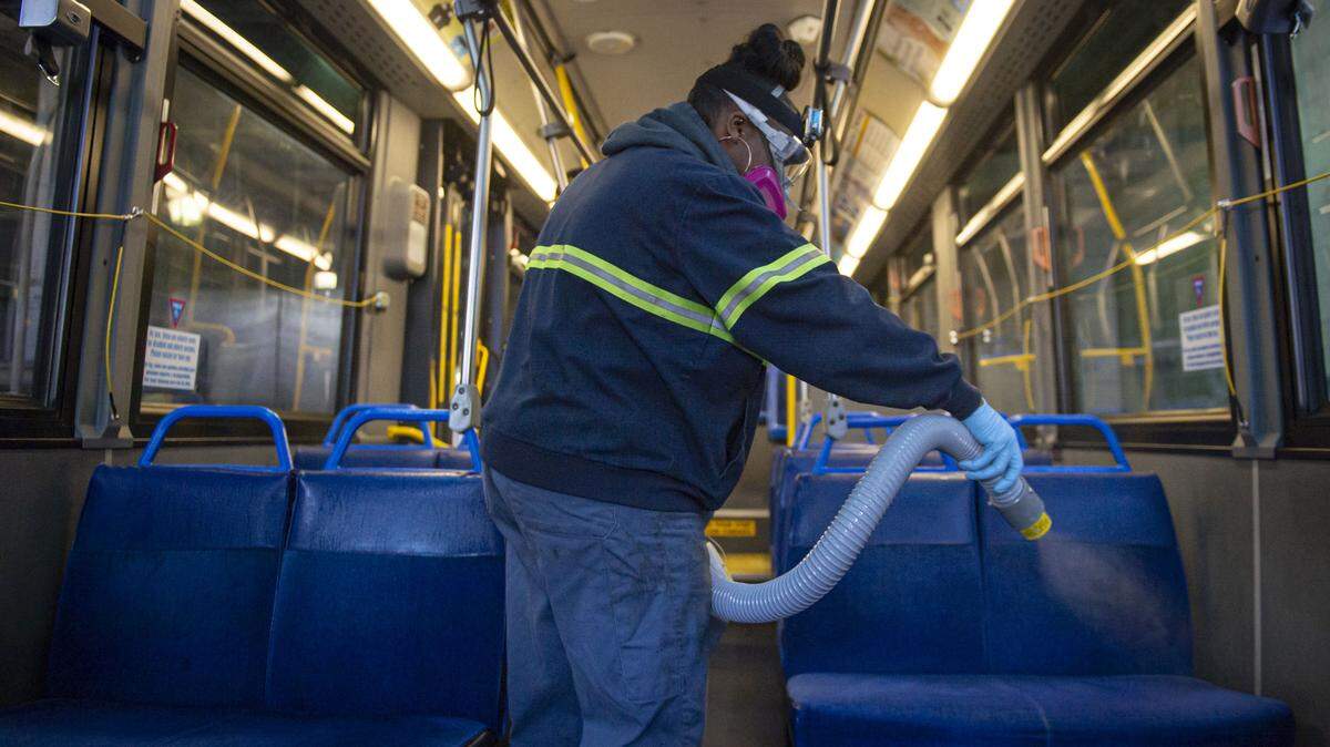 A SacRT employee sprays chlorine dioxide on the seats of a bus Wednesday, March 4, 2020, as part of the transit agency’s effort to take precautions against coronavirus. The 300 plus SacRT busses and light rail trains are cleaned with sanitizer each night and fogged with chlorine dioxide every five days, up from once every couple of weeks.