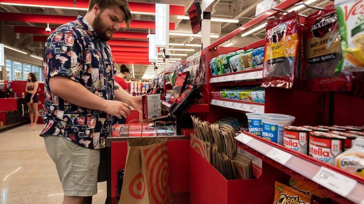 Andy Poppert, of New Hope, scans his purchases at the self-checkout during a sneak peek of the Target in Doylestown Borough, on Tuesday, July 16, 2024.