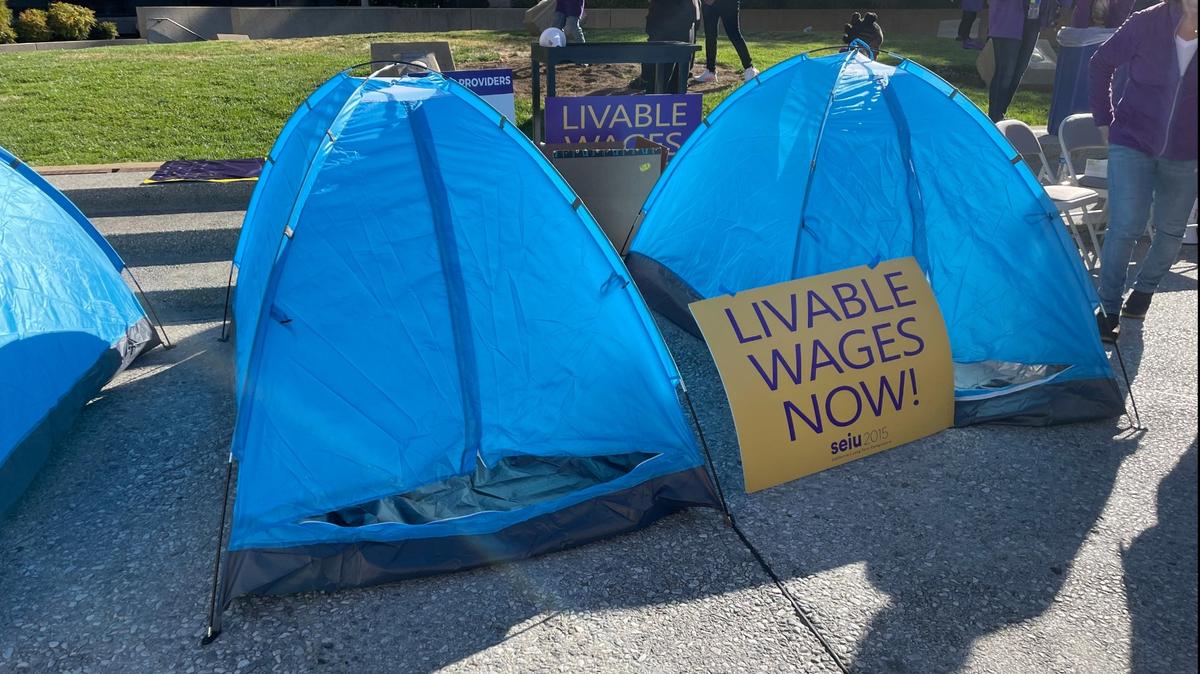 After county negotiators offered unionized workers a raise to $18 an hour when they asked for $20, SEIU 2015 long-term caregivers slept in tents Monday night outside the Sacramento County Administration Building in protest. They said their wages put them at risk of homelessness.