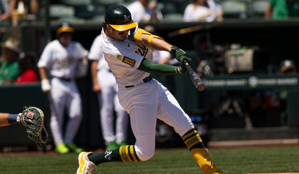 Athletics shortstop Jacob Wilson (5) connects for a hit during an MLB game against the Seattle Mariners at Sutter Health Park on Wednesday in West Sacramento.