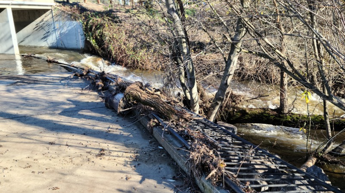 In a report submitted to the Folsom Connect app, storm debris causes damage to a fence along the Humbug Willow Creek Trail under East Bidwell Street east of Creekside Drive on Jan. 3, 2023. The city of Folsom sent out a storm alert Tuesday in preparation for upcoming winter storms.