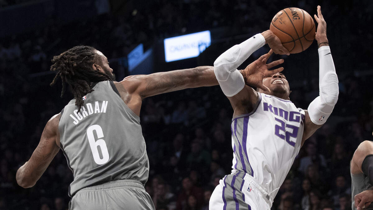 Brooklyn’s DeAndre Jordan fouls Sacramento’s Richaun Holmes during their game Friday night.