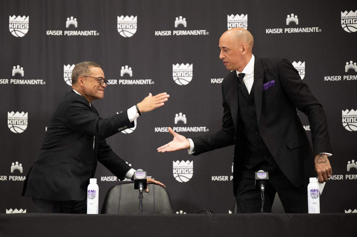 Sacramento Kings general manager Scott Perry introduces head coach Doug Christie during a press conference at Golden 1 Center on Friday in Sacramento. 