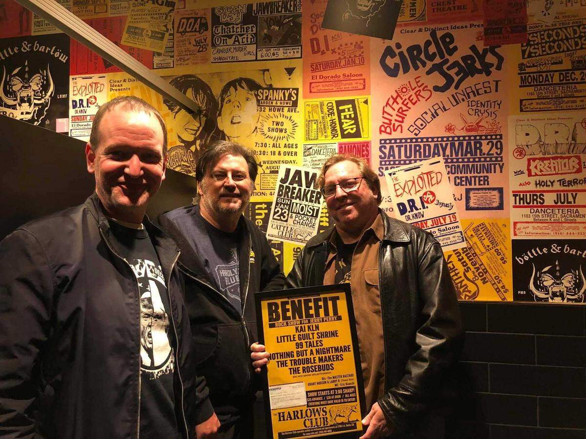 Brian McKenna, right, with former Kai Kln manager Mark Malakie, left, presents a check to Jerry Perry following a 2018 benefit concert to raise funds for Perry following a stroke. McKenna, a longtime concert promoter and booker, was recently hospitalized and local musicians are raising money for his medical expenses with a concert Monday at Harlow’s in midtown Sacramento.
