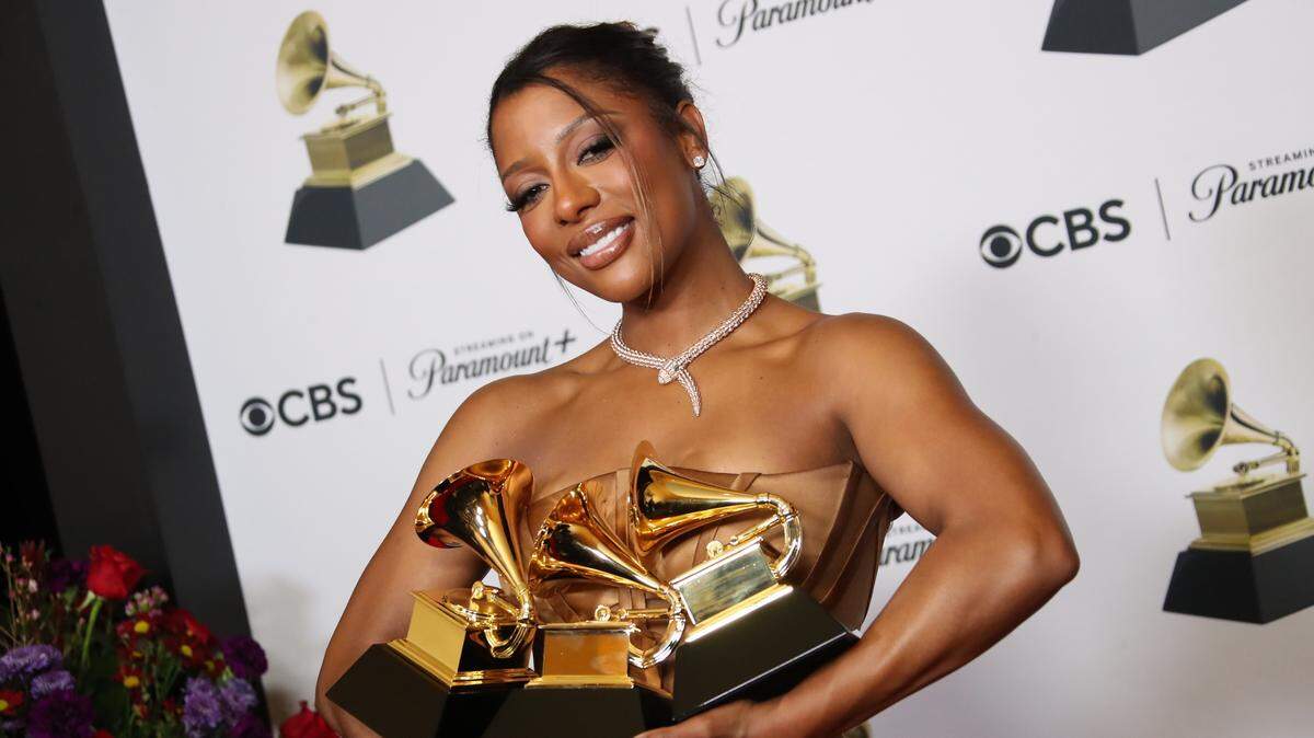 Victoria Monet, winner of Best New Artist, Best Engineered Album, Non-Classical, and Best R&B Album for ‘Jaguar II’, holds her three Grammy Awards at the 66th Annual Grammy Awards at Crypto.com Arena in Los Angeles on Sunday.
