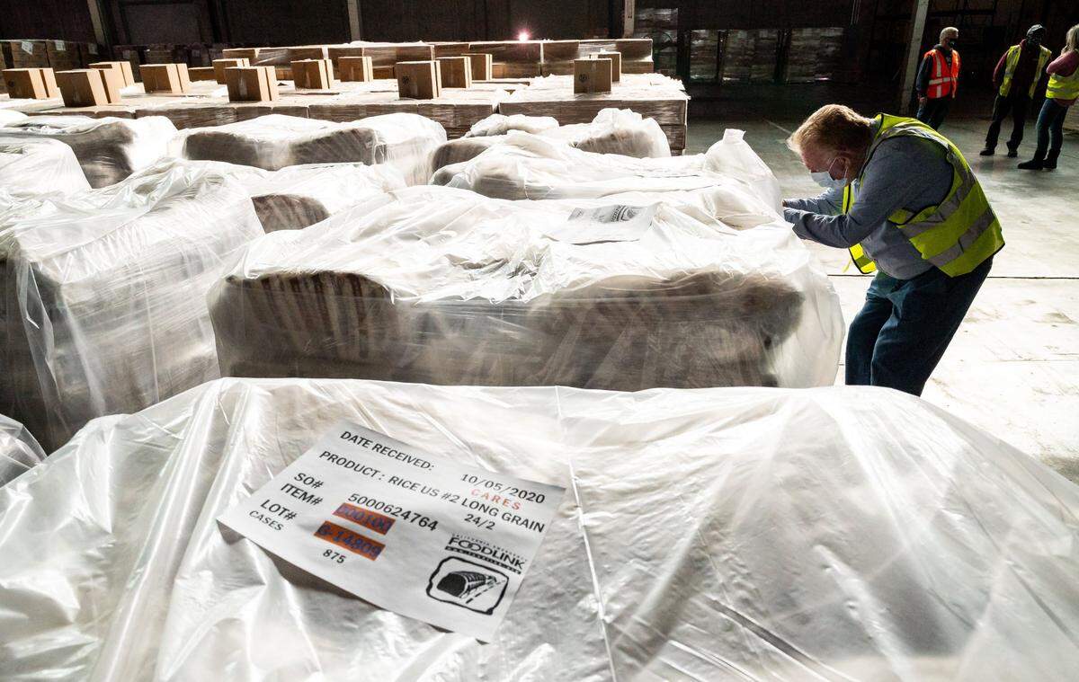 California Emergency Foodlink CEO John Healey, who founded the nonprofit in 1992, leads a tour of Foodlink’s warehouses Nov. 10 on the Depot Park business campus in Sacramento.