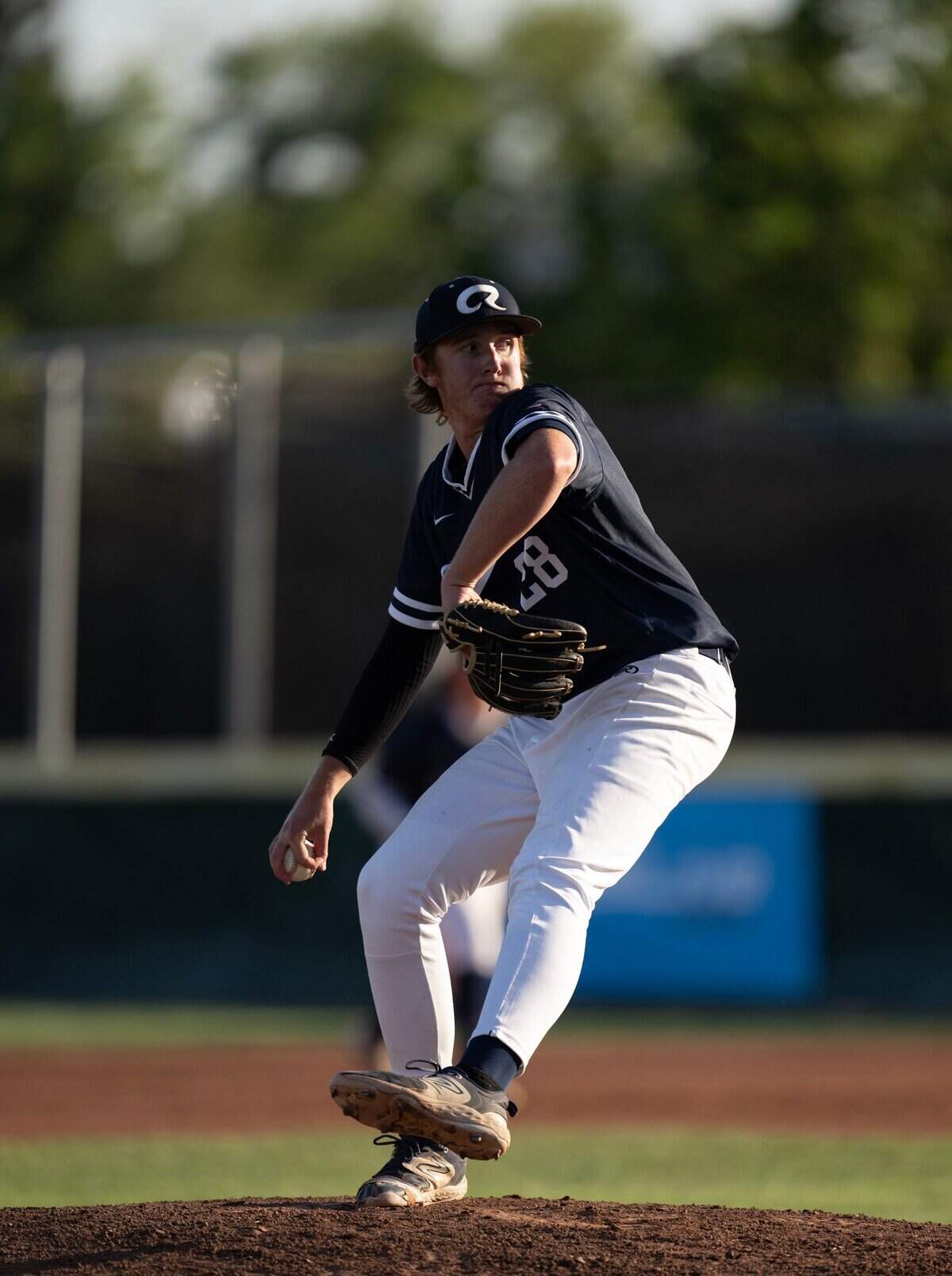 Casa Roble starting pitcher Jacob Schreiber delivers a pitch in the third inning against Twelve Bridges during a CIF Sac-Joaquin Section Division IV baseball section championship game on Wednesday at Sacramento City College.
