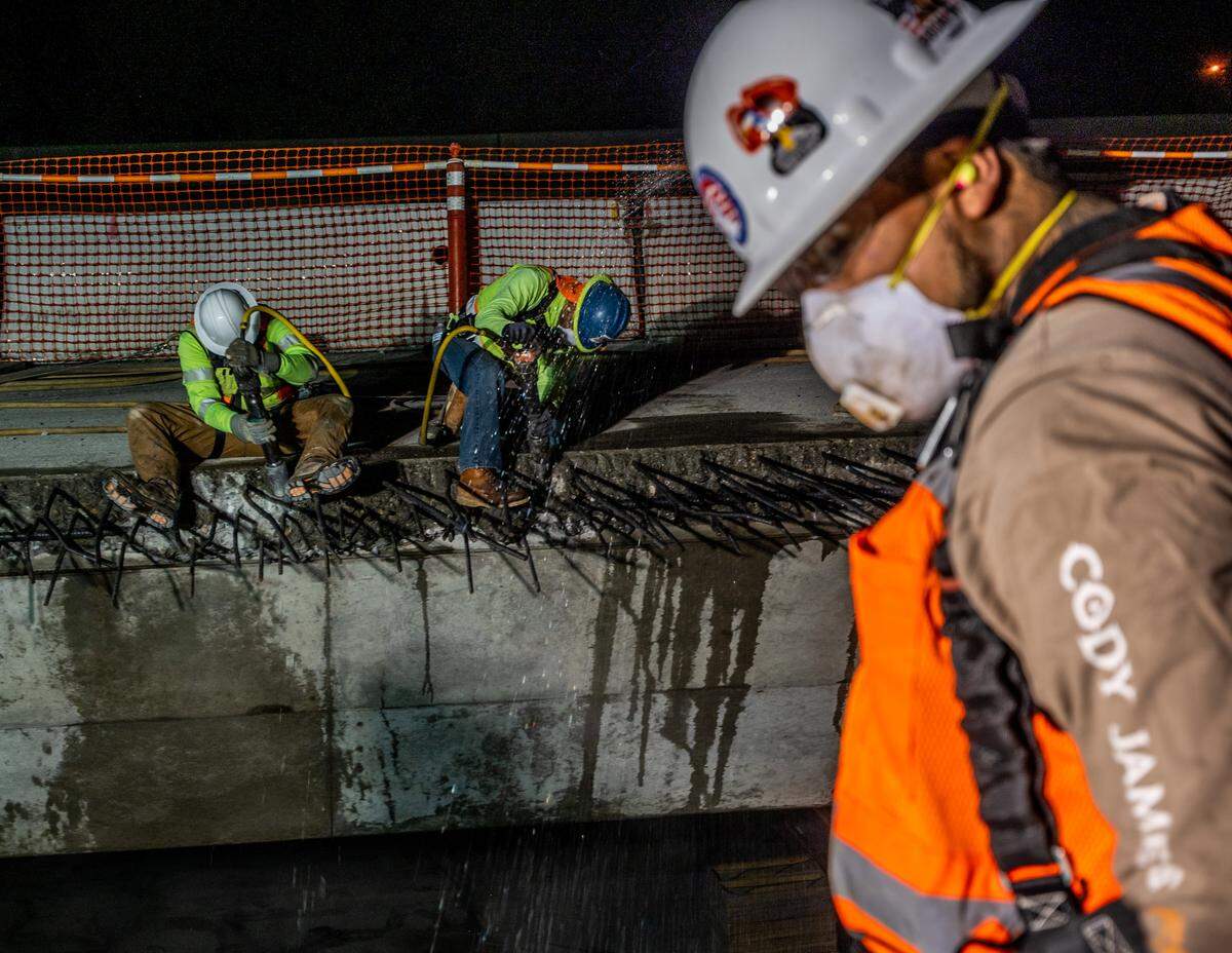 Construction workers work on the W-X segment of Highway 50 in Sacramento in May 2021. The project was originally expected to be completed by late 2024 or early 2025.
