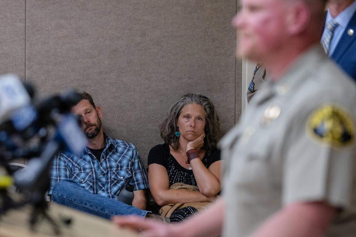 Family members sit along the wall and listen to Capt. Sam Brown of the Nevada County Sheriff’s Office answers questions from the press regarding Kiely Rodni on Monday at the Truckee Donner Recreation and Park District offices in Truckee.