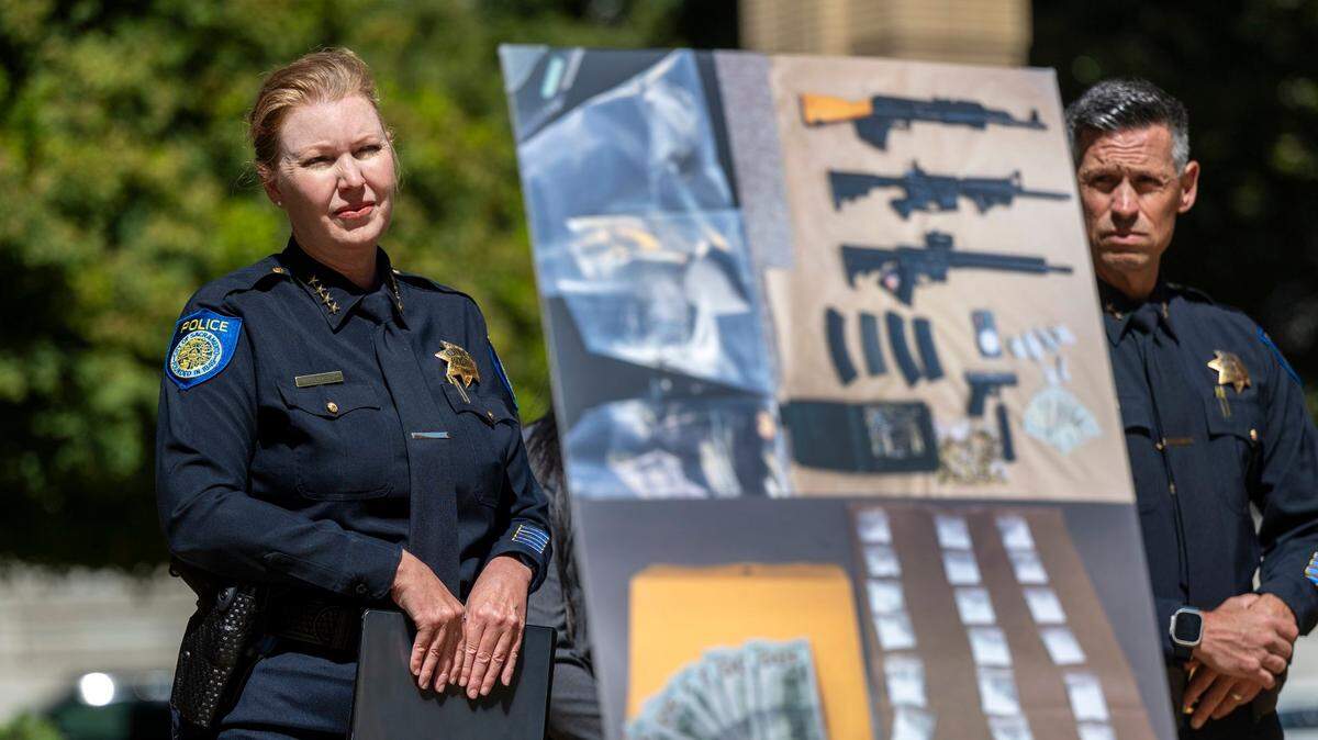 Sacramento Police Chief Katherine Lester stands near a display, depicting drugs and firearms seized from dealers and buyers in the city’s downtown core, during a news conference at City Hall on July 16. 