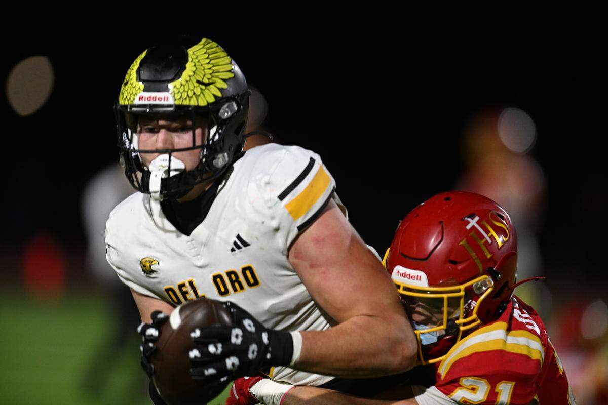 Del Oro Eagles tight end Luke Galer (8) is tackled by the Jesuit Marauders’ Alex Dewar in October. Galer signed with Washington State.