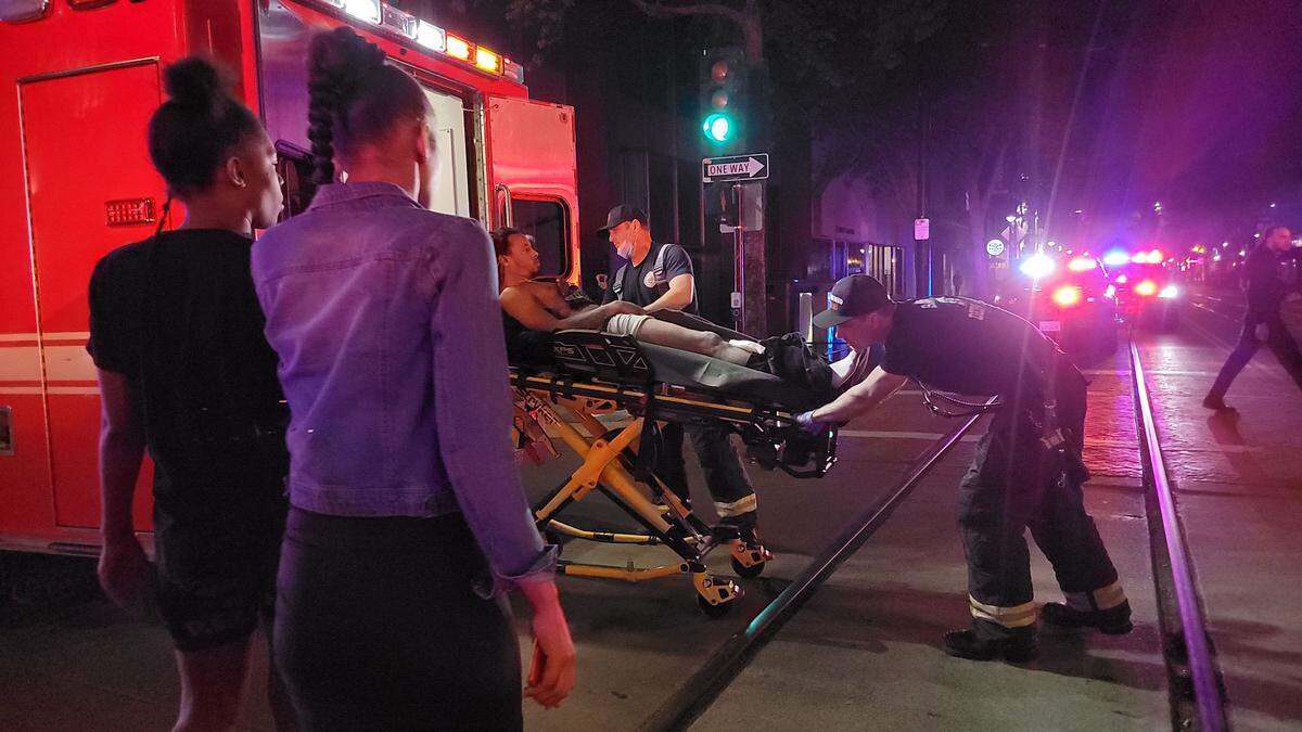 First responders place a victim into an ambulance at the scene of a mass shooting in downtown Sacramento on Sunday. 