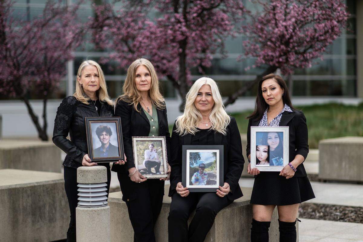 Mothers who lost their children to fentanyl deaths, from left, Laura Didier, Laura Collanton, Elizabeth Dillender and Gina Leah Chavez, hold photos at Placer County Superior Court in Roseville last month. The mothers said they have bonded after experiencing the loss of their children to fentanyl.