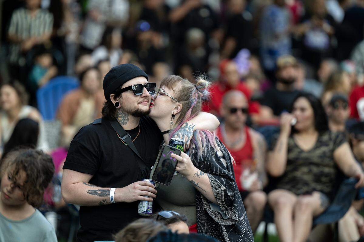 Concert attendees cheer during a performance at Concerts in the Park across from Sacramento City Hall on Friday.